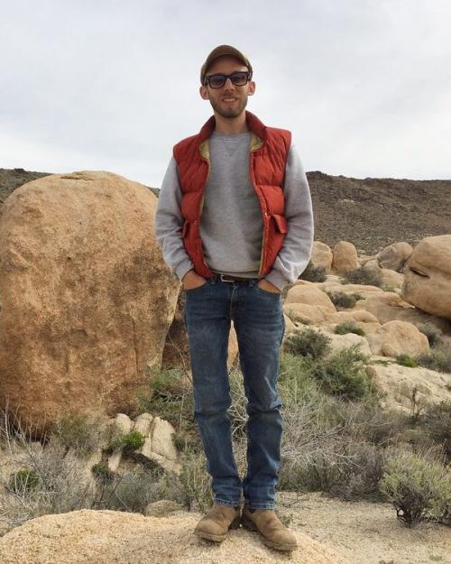 Person standing on a rock in the desert